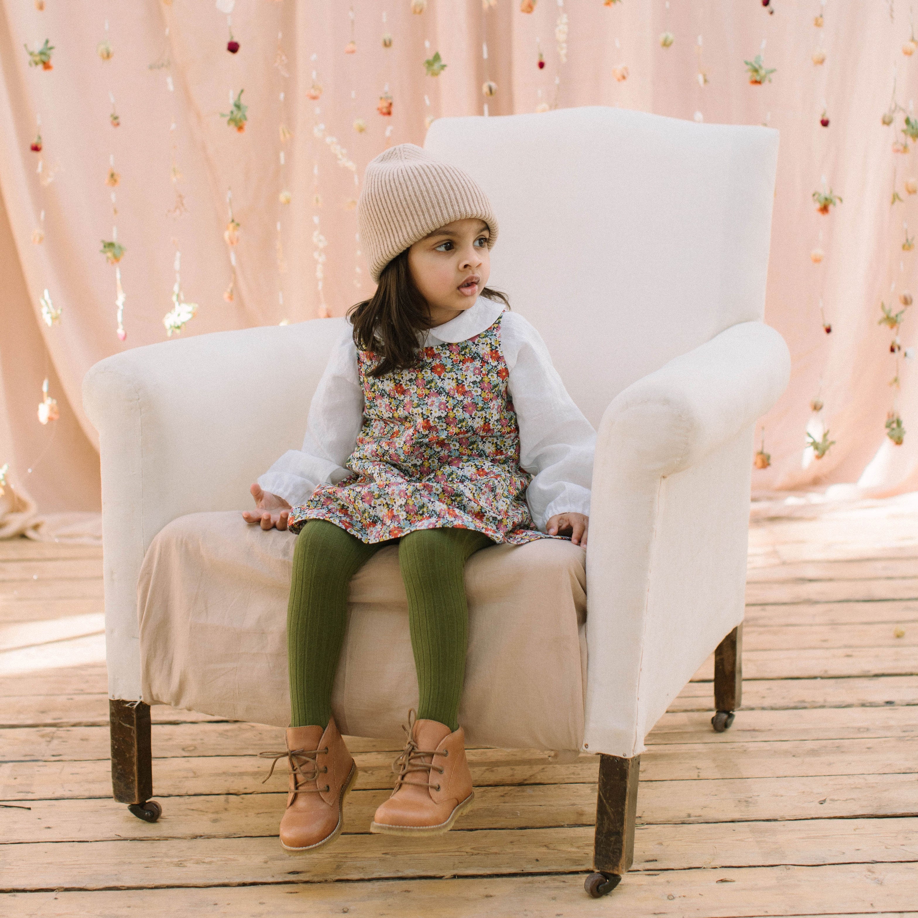 Simple A-line shaped pinafore dress with front pockets and tie at the back of the neck. Designed to sit above the knee and is perfect layered over an NQ blouse or stripped back in warmer weather. Made from beautiful Libby Liberty print tana lawn cotton.