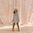 Simple A-line shaped pinafore dress with front pockets and tie at the back of the neck. Designed to sit above the knee and is perfect layered over an NQ blouse or stripped back in warmer weather. Made from beautiful Libby Liberty print tana lawn cotton.
