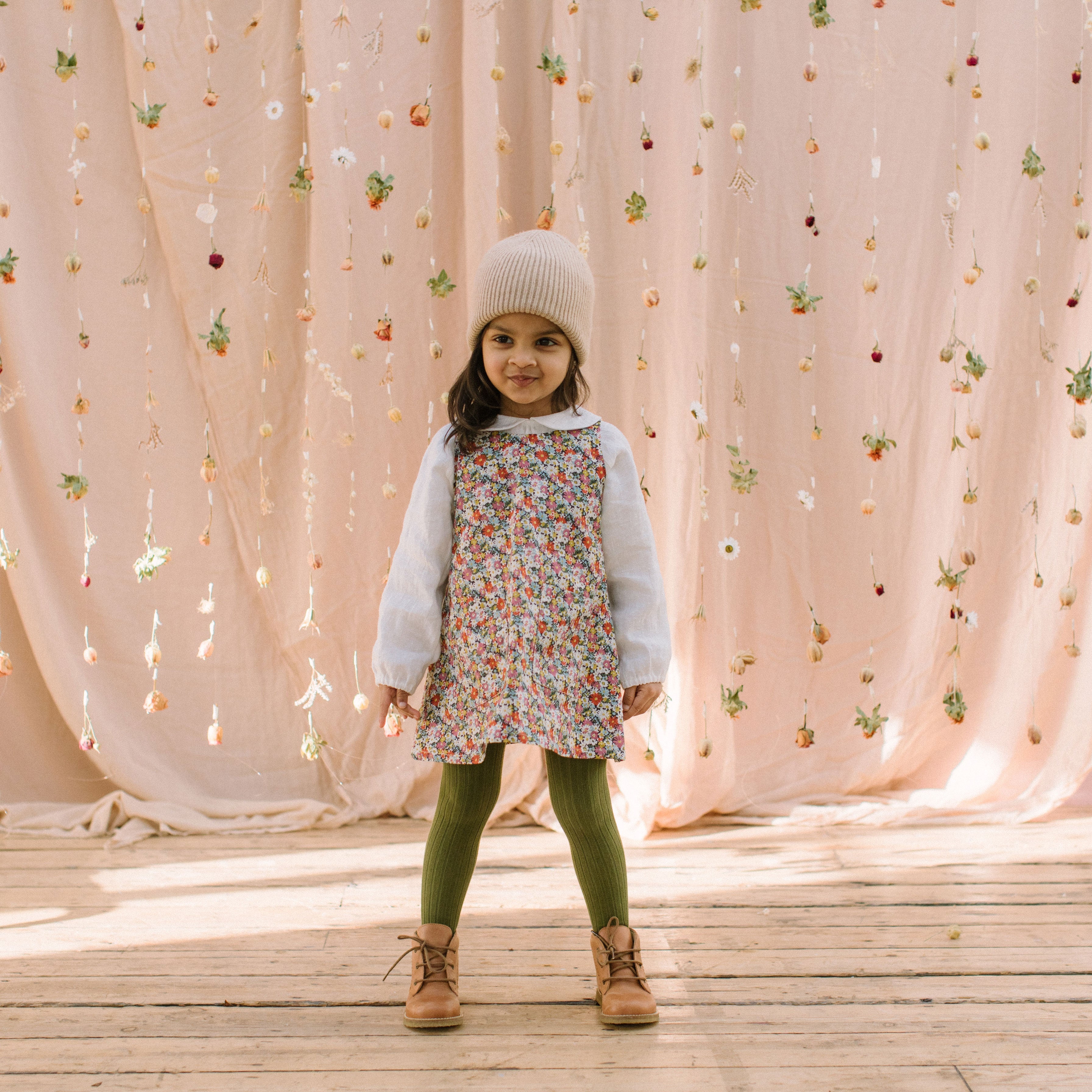 Simple A-line shaped pinafore dress with front pockets and tie at the back of the neck. Designed to sit above the knee and is perfect layered over an NQ blouse or stripped back in warmer weather. Made from beautiful Libby Liberty print tana lawn cotton.