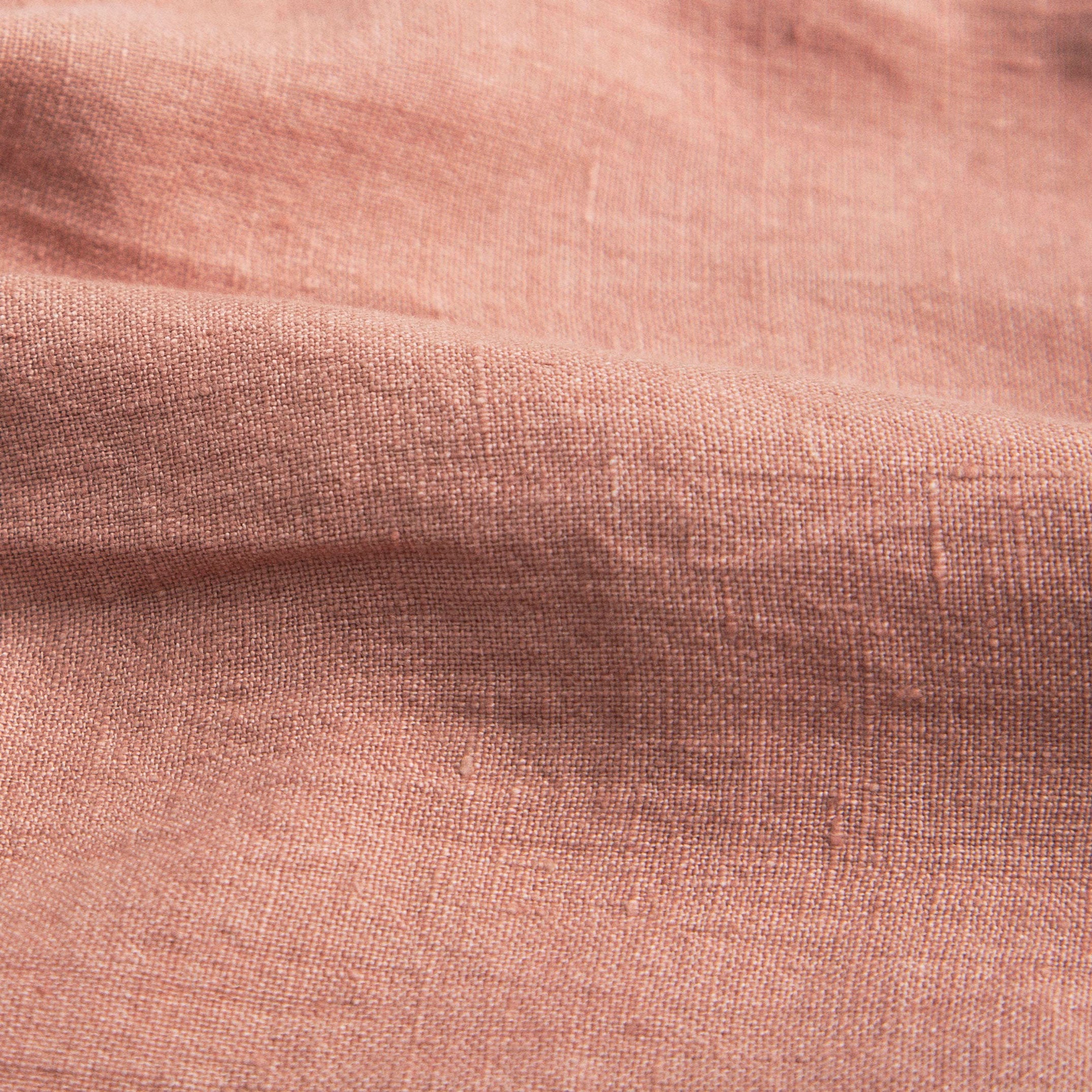 Full, floaty dress, with high empire line, full elasticated sleeves, small neck ruffle and mother of pearl buttons down the back yolk. Attached gathered skirt sits at a longer length below the knee. Designed to be oversized for a stylish, comfortable fit. Made from beautifully soft, dusty rose linen.