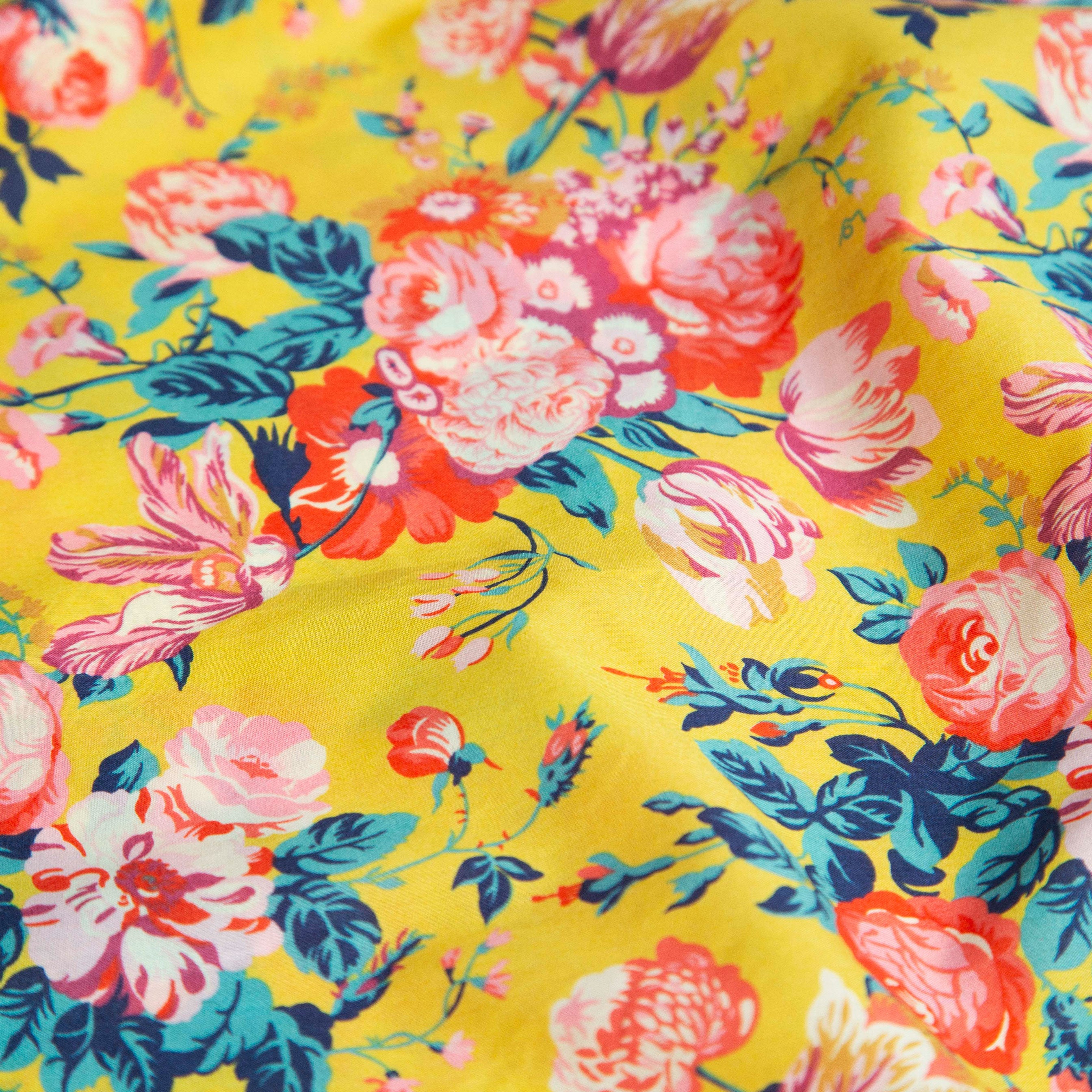 Comfy jumpsuit with loosely fitted wrap over top and tie up shoulder straps. Loose fitting straight leg trousers can be styled with a rolled up hem, turned down for growth spurts. Made from beautifully soft, Magical Bouquet Liberty print linen.