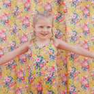 Comfy jumpsuit with loosely fitted wrap over top and tie up shoulder straps. Loose fitting straight leg trousers can be styled with a rolled up hem, turned down for growth spurts. Made from beautifully soft, Magical Bouquet Liberty print linen.