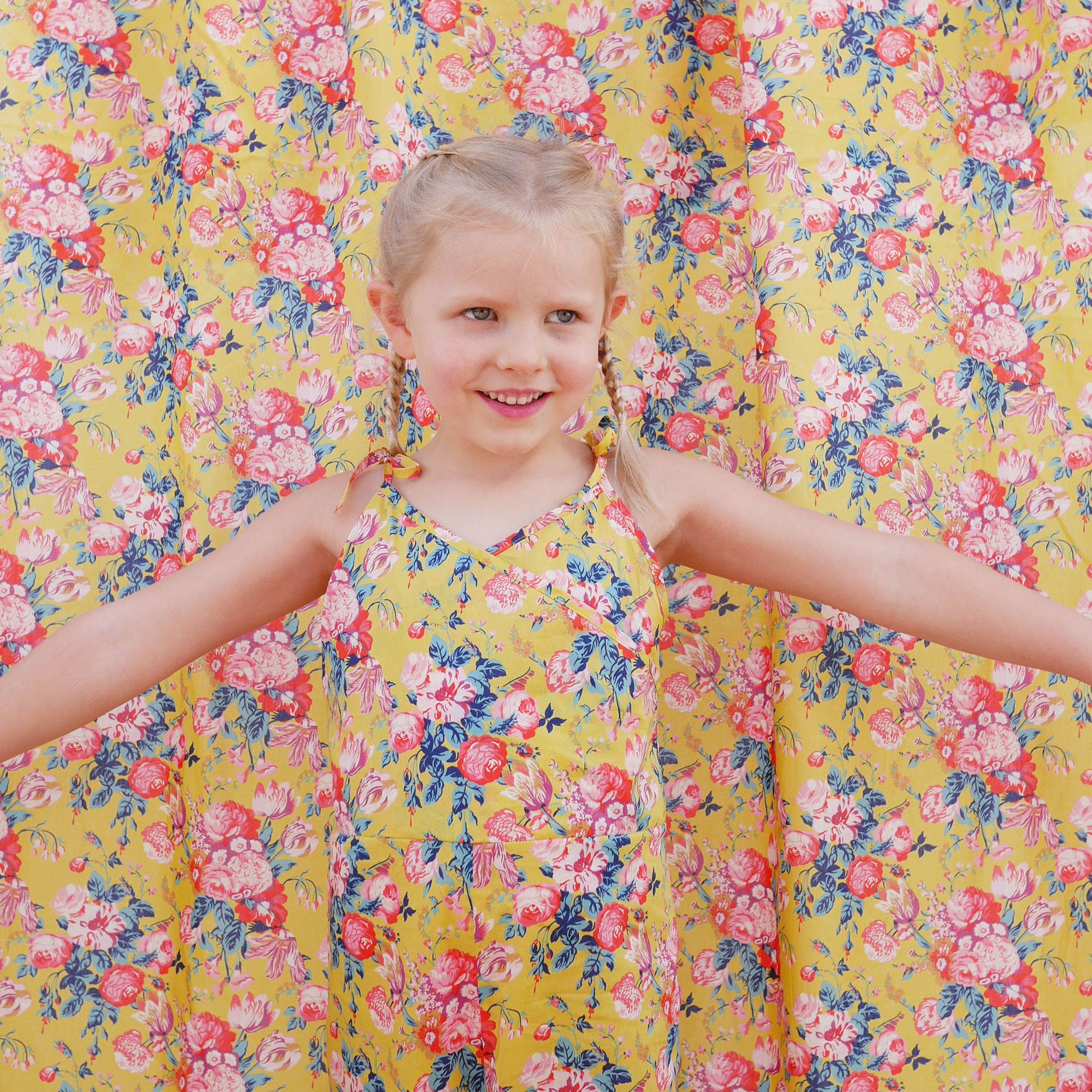 Comfy jumpsuit with loosely fitted wrap over top and tie up shoulder straps. Loose fitting straight leg trousers can be styled with a rolled up hem, turned down for growth spurts. Made from beautifully soft, Magical Bouquet Liberty print linen.