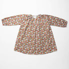 Loose fit, raglan sleeve peasant dress, with puffed, long, full sleeves, elasticated cuffs and mother of pearl button up front. Neck line is gathered, to create an oversized style and comfortable fit. Two pockets sit at the front of the dress, perfect for storing treasures. Designed to sit above the knee and made from beautiful Libby Liberty print tana lawn cotton.
