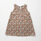 Simple A-line shaped pinafore dress with front pockets and tie at the back of the neck. Designed to sit above the knee and is perfect layered over an NQ blouse or stripped back in warmer weather. Made from beautiful Libby Liberty print tana lawn cotton.