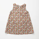 Simple A-line shaped pinafore dress with front pockets and tie at the back of the neck. Designed to sit above the knee and is perfect layered over an NQ blouse or stripped back in warmer weather. Made from beautiful Libby Liberty print tana lawn cotton.